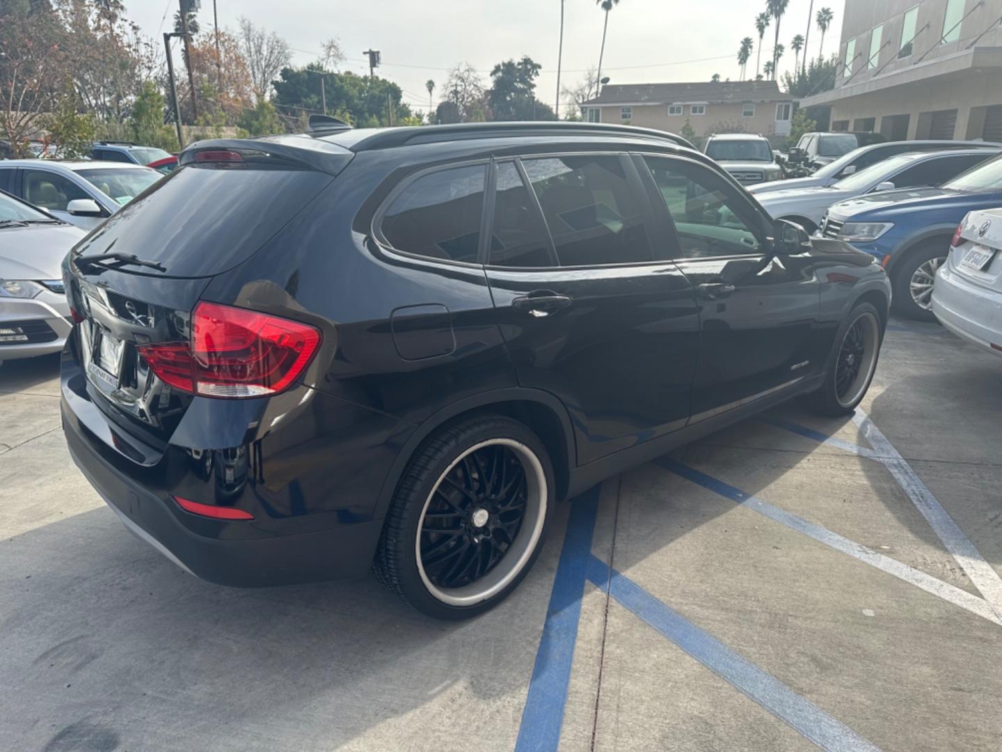 2014 Black /Black BMW X1 (WBAVM1C57EV) with an 4 CYLINDER engine, Automatic transmission, located at 30 S. Berkeley Avenue, Pasadena, CA, 91107, (626) 248-7567, 34.145447, -118.109398 - Photo#5